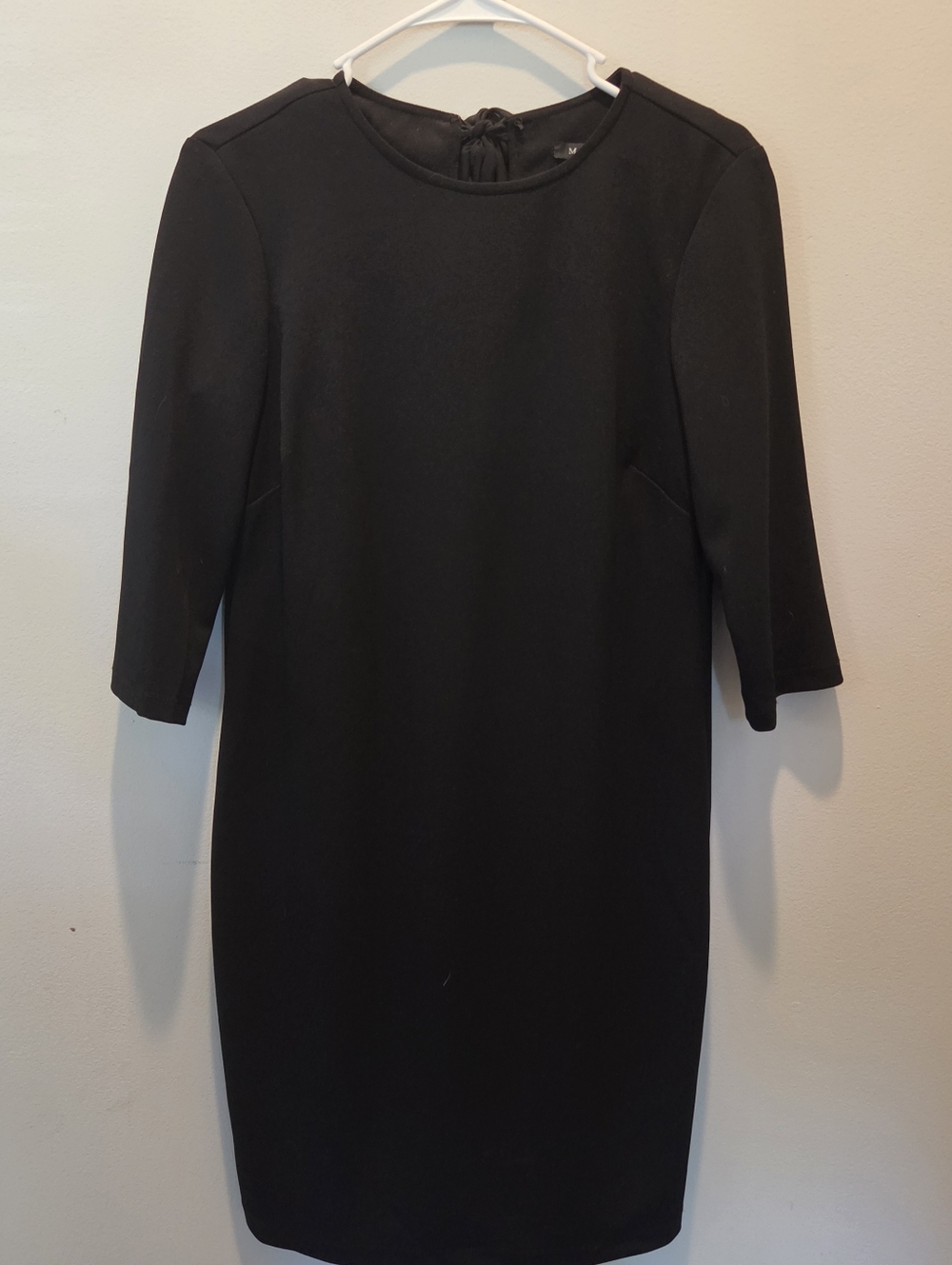 Marina Little Black Dress With Tie Back And Quart Length Sleeves